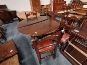 An oak carved extending dining table and 5 x chairs