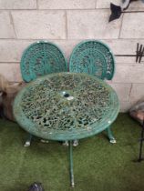 Green round bistro set with 2 matching chairs