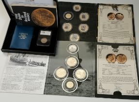 Two WWII commemorative proof coin sets