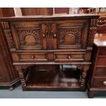 A Titchmarsh,arsh and Goodwin style carved oak sewing cabinet
