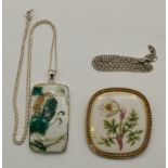 A silver-mounted Chinese porcelain plaque pendant, and a Danish silver-mounted porcelain brooch