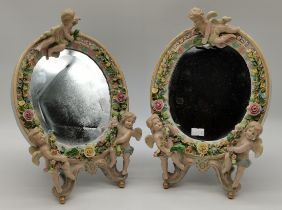 A pair of Sitzendorf oval porcelain framed mirrors, and a pair of similar porcelain wall brackets