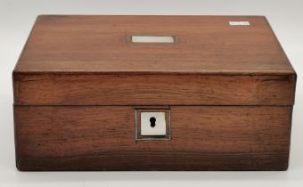 A small mother-of-pearl inlaid mahogany writing box