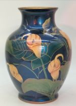 An oriental iridescent blue glazed ceramic vase