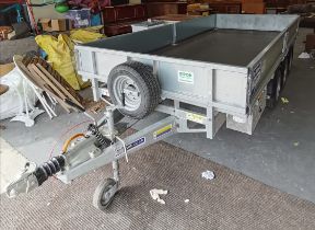 An Ifor Williams tri-axle drop-side flatbed trailer