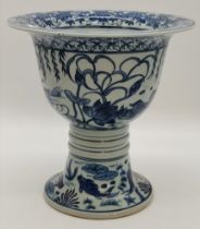 A blue and white Chinoiserie porcelain urn