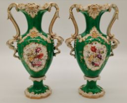 A pair of Rococo twin-handled porcelain vases