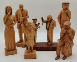 Six fruitwood hand carved figure groups