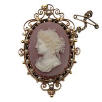 A 19TH CENTURY YELLOW METAL, CARNELIAN, SEED PEARL AND ENAMEL CAMEO BROOCH Fine carved female