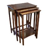 A NEST OF THREE EDWARDIAN MAHOGANY AND LINE INLAID OCCASIONAL TABLES. (42cm x 28cm x 58cm)