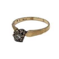 AN EARLY 20TH CENTURY 9CT GOLD AND DIAMOND SOLITAIRE RING Having a single round cut diamond in an