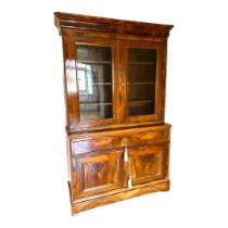 A 19TH CENTURY ITALIAN FIGURED WALNUT DRESSER With deep cushions cornice above two glazed doors, one