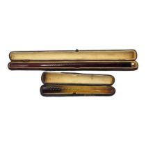 A LARGE EARLY 20TH CENTURY 9CT GOLD AND CHERRY AMBER CIGARETTE HOLDER Faceted amber in a fitted