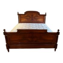A 19TH CENTURY FRENCH WALNUT DOUBLE BEDSTEAD With hump back and turned finials, complete with