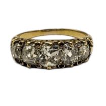 AN EARLY 20TH CENTURY YELLOW METAL AND DIAMOND FIVE STONE RING Having a row of graduated oval cut