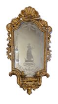 AN 18TH/19TH CENTURY ITALIAN GILTWOOD FRAMED GIRONDELLE MIRROR The shell crest above silvered