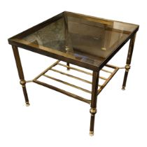 IN THE MANNER OF MAISON JANSEN, A VINTAGE BRASS TWO TIER OCCASIONAL TABLE With square glass inset