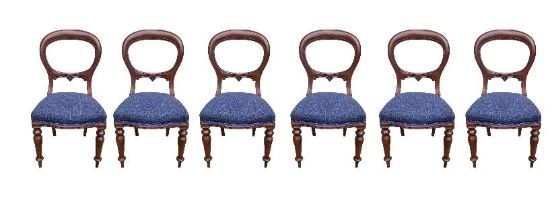 A SET OF SIX VICTORIAN MAHOGANY SPOON BACK DINING CHAIRS Carved back rail, overstuffed blue fabric