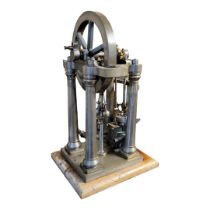 A VINTAGE TABLE TOP BRASS,STEEL AND MAHOGANY VERTICAL STEAM ENGINE On hardwood stand. (68cm)