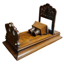 A VICTORIAN FIGURED WALNUT TABLE TOP STEREOSCOPIC VIEWER. (length 59cm x w 30cm x h 34cm) Condition: