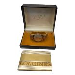 LONGINES, A VINTAGE 9CT GOLD GENT’S WRISTWATCH Having silver tone dial with Arabic number markings