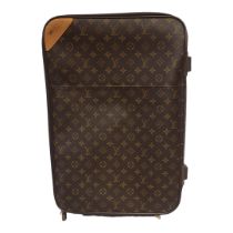 LOUIS VUITTON, A VINTAGE LEATHER MONOGRAM SUITCASE Having an extending handle, carry handle,