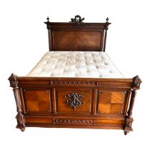 A LATE 19TH CENTURY FRENCH MAHOGANY DOUBLE BEDSTEAD Crested with carved cartouche and finals, reeded