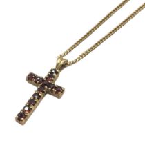 A VINTAGE 9CT GOLD AND GARNET CRUCIFIX PENDANT NECKLACE A single rows of round cut garnets, on a