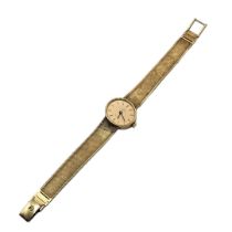 OMEGA, A VINTAGE 9CT GOLD LADIES’ WRISTWATCH Oval form gold tone dial and quartz movement, on an