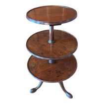 AN EARLY VICTORIAN MAHOGANY THREE TIER DUMBWAITER With graduated circular dish trays centred by a