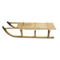 DAVOS OF SWITZERLAND, A LATE 20TH CENTURY OAK CASED MODEL OF WINTER SLEIGH. (length 110cm x h