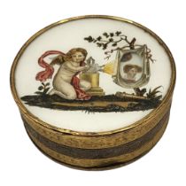 A FRENCH 19TH CENTURY LIMELIGHT SATURATOR BONBON BOX The lid featuring a kneeling putti with magic