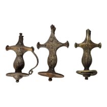 A SET OF THREE ANTIQUE CENTRAL INDIA TALWAR SWORD POMMEL HANDLES Possibly made from imported