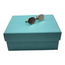 TIFFANY, A PAIR OF SILVER GENTS CUFFLINKS Plain oval form, in turquoise box and bag. Condition: good