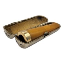 A VICTORIAN 15CT GOLD AND BUTTERSCOTCH AMBER CIGARETTE HOLDER In a Victorian silver holder, marked