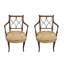 A PAIR OF REGENCY BEECHWOOD OPEN ARMCHAIR CHAIRS With double cross backs and recently