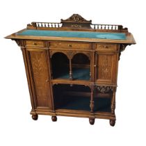 A VICTORIAN WALNUT AND PARCEL GILT SIDE CABINET With turned spindle gallery above an arrangement