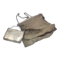 AN EARLY 20TH CENTURY SILVER MESH PURSE Hallmarked Birmingham, 1922, together with a solid purse