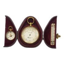 SHORT AND MASON LTD, A POCKET GILT METAL BAROMETER, COMPASS AND THERMOMETER SET Having a silver tone