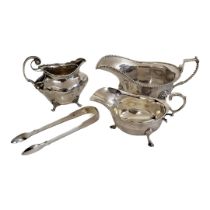 A COLLECTION OF THREE VINTAGE SILVER SAUCE BOATS To include a boat with lion mask mounts,