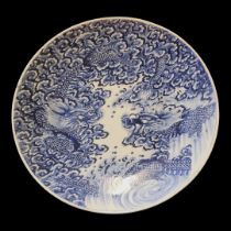 A LARGE JAPANESE MEIJI BLUE AND WHITE CHARGER Hand painted decoration of opposing dragons within