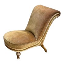 A VICTORIAN GILTWOOD FRAMED NURSING CHAIR In a faded velvet fabric, on melon section turned legs