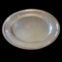 A 20TH CENTURY CONTINENTAL WHITE METAL CIRCULAR SALVER TRAY With classical accents leaf decoration