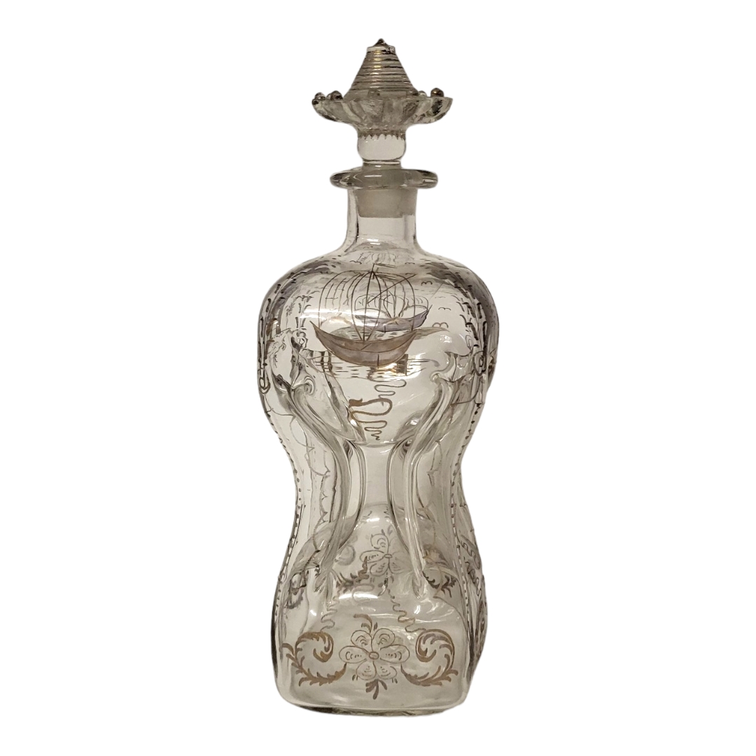 AN 18TH CENTURY DUTCH COLONIAL HAND BLOWN DECANTER AND FLATTENED MUSHROOM STOPPER, CIRCA 1780 The
