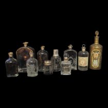 A COLLECTION OF 19TH CENTURY CONTINENTAL SCENT DECANTERS Having cork stoppers with etched and gilded