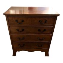 A GEORGIAN STYLE MAHOGANY CHEST Having an arrangement of four long drawers, with shaped apron,