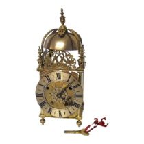 A 17TH CENTURY AND LATER BRASS LANTERN BRACKET CLOCK Having a pierced brass frame and three bevelled