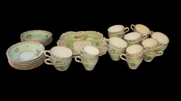 AN EARLY 19TH CENTURY ENGLISH PORCELAIN TEA AND COFFEE SERVICE Comprising twelve teacups, six coffee