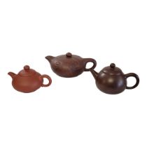 A COLLECTION OF THREE 20TH CENTURY CHINESE TERRACOTTA POTTERY TEAPOTS To include a teapot with