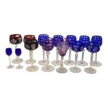 A COLLECTION OF 20TH CENTURY BOHEMIAN WINE GLASSES To include seven overlaid blue and three claret